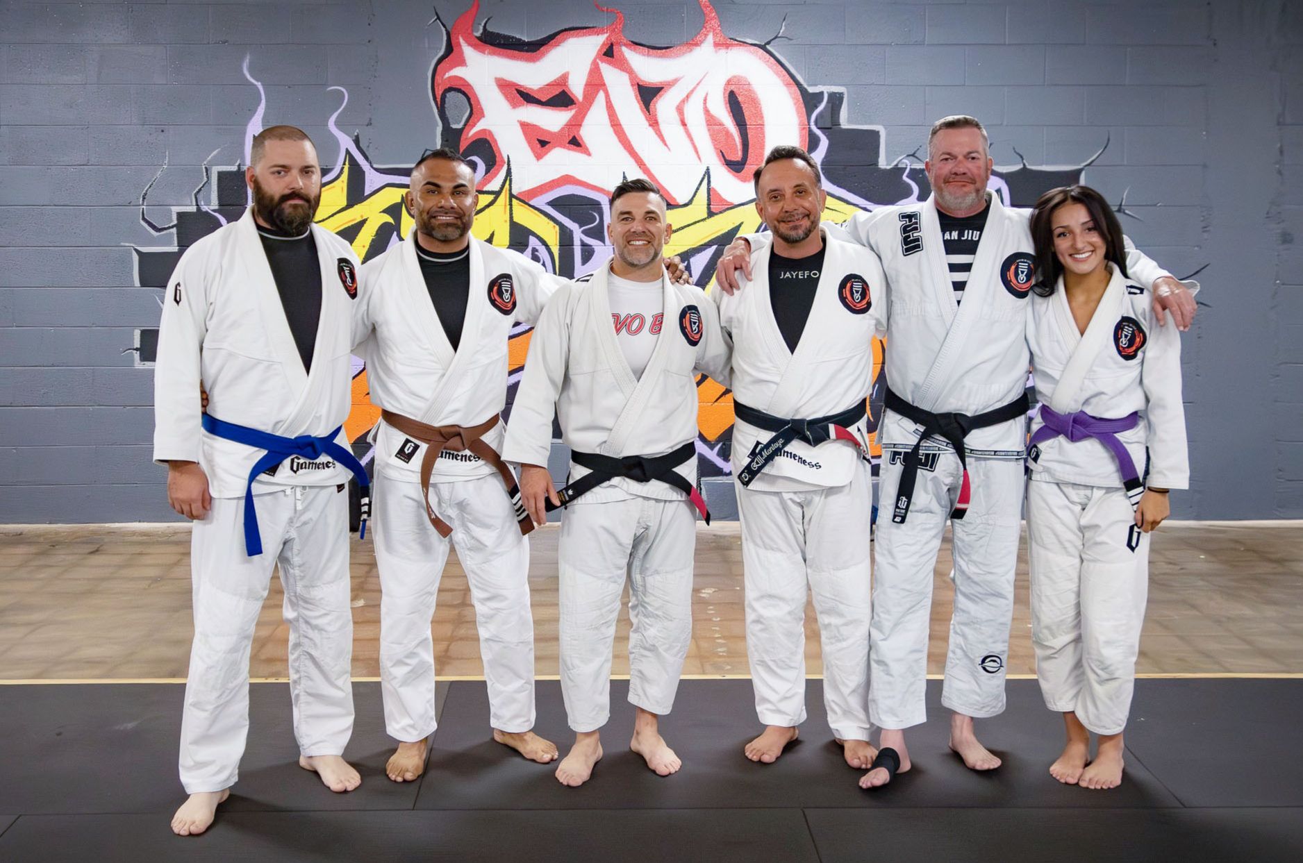 The Second Grip Jiu Jitsu team lined up in their gis on the mats in Carlsbad, New Mexico